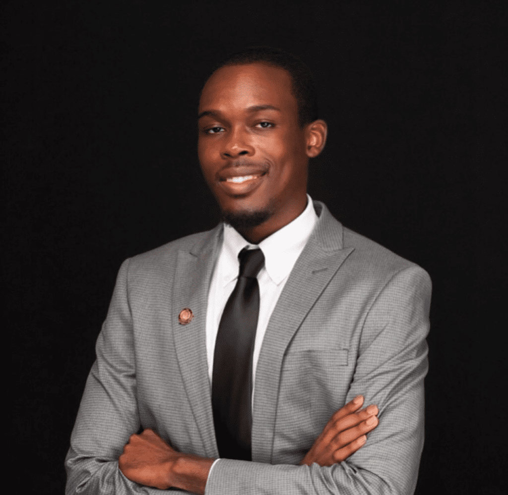 Alexander walker of Web3 domains wearing a suit smiling