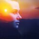 Double multiply exposure abstract dark portrait of a dreamy cute young woman face head sun silhouette in sky, sunrise nature. Psychology power of mind, human spirit, mental health, life zen concept