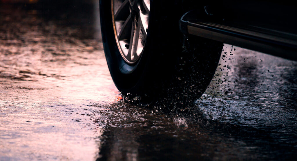 Worn Tires and Wet Roads