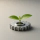 Green seedling sprouting from a polished metal gear on a soft gray background, symbolizing nurtured small-business innovation.