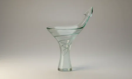 Glass funnel morphing into an upward arrow on a soft background, symbolizing optimized onboarding and growth.