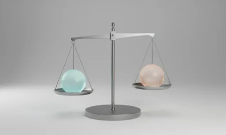 Minimalist balance scale with two identical glowing spheres, symbolizing a tough choice, on a soft neutral background.