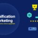 Gamification marketing illustration with a gold trophy, leaderboard rankings, points badge, progress bar, star ratings, game controller, MVP medal, and achievement unlock notification