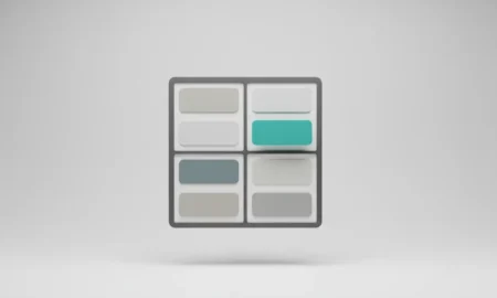 Minimal 2x2 board with blank cards; one elevated, highlighted card signals top priority and momentum.