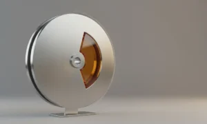 Metal flywheel with a glowing accent wedge, spinning on a soft gray background to symbolize unconventional business acceleration.