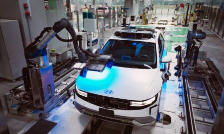 Digital twin technology concept showing virtual and physical manufacturing systems converging in smart factory environment