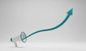 Minimal 3D megaphone projecting a teal arrow that bends upward on a neutral background, symbolizing a marketing-driven growth surge.