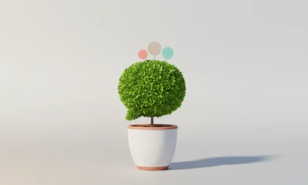 Minimalist potted plant shaped like a speech bubble, symbolizing nurtured social media growth on a soft neutral background.