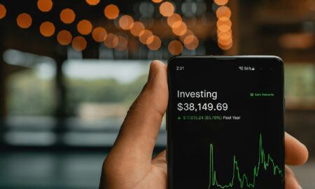 Investor analyzing stock market charts and ETF performance data for smart investing strategies and long-term financial growth