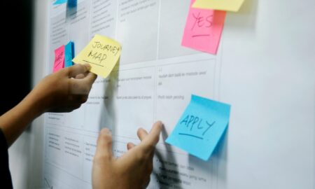 Professional working remotely on a laptop while managing productivity and side hustle projects in a digital workspace
