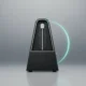 Sleek black metronome with cyan pendulum trail on soft gray background, evoking cadence as a business velocity metric.