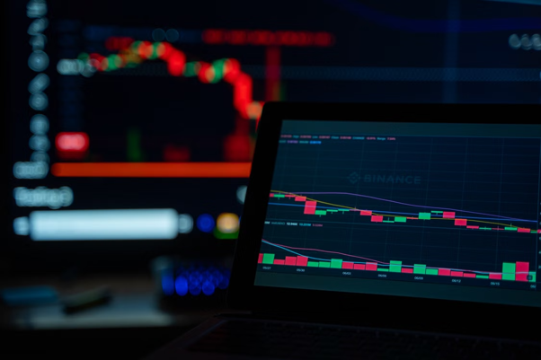 Digital illustration showing BlockDAG, Cardano, and World Liberty Financial price charts with crypto staking, blockchain analytics, and market trend indicators.