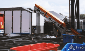 rStream's AI-powered sorting system, a 30-foot integrated conveyor and sorting platform, combines computer vision, precision actuation, and machine learning to automatically separate the full waste stream at the source—offering a glimpse into the future of automated waste management at large venues.