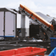 rStream's AI-powered sorting system, a 30-foot integrated conveyor and sorting platform, combines computer vision, precision actuation, and machine learning to automatically separate the full waste stream at the source—offering a glimpse into the future of automated waste management at large venues.