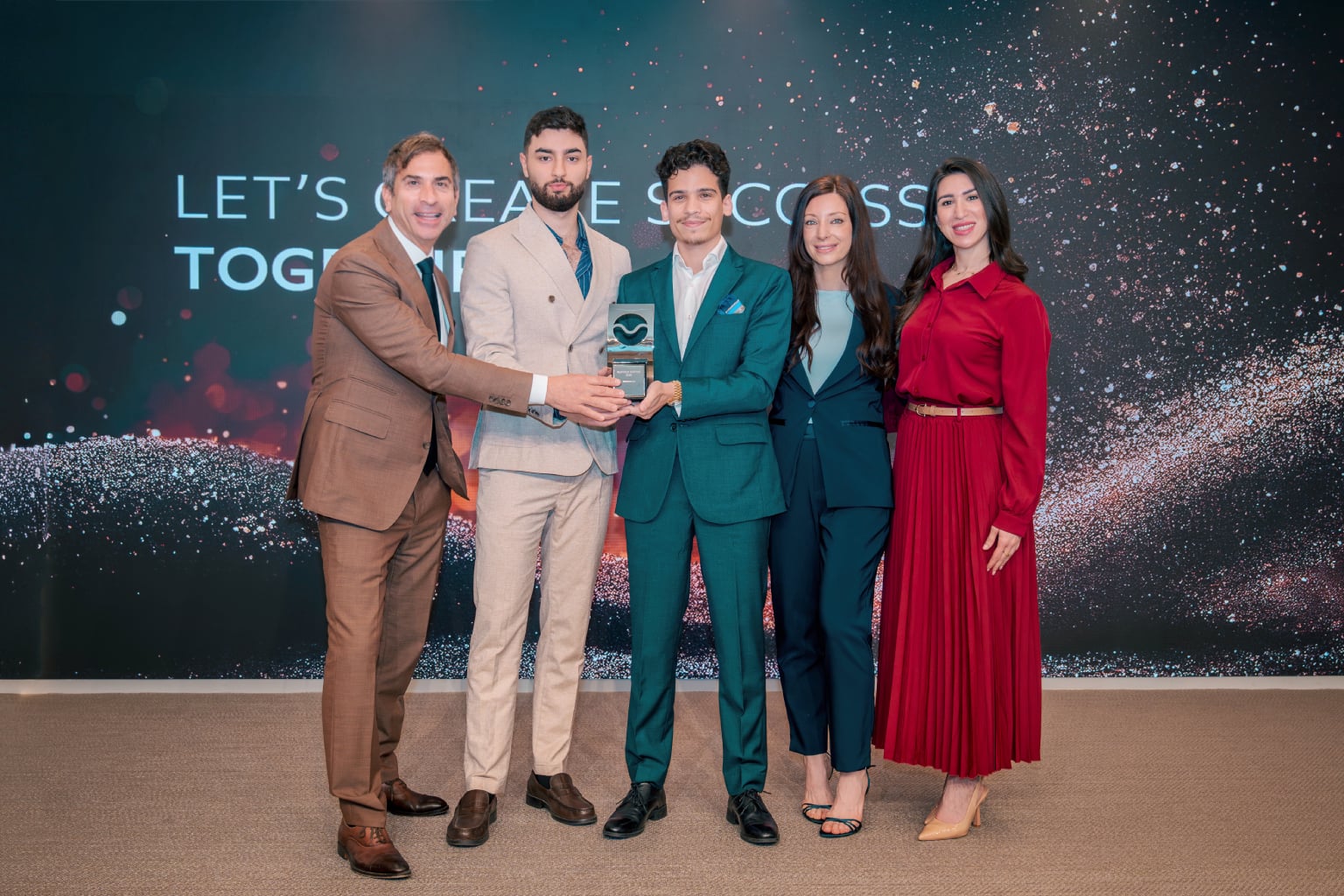 Caption: GenZone team receiving the Titanium Award for outstanding performance from Dubai Free Zone authorities
