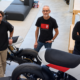 Three members of the Real Motors team alongside Project ARES motorcycles.