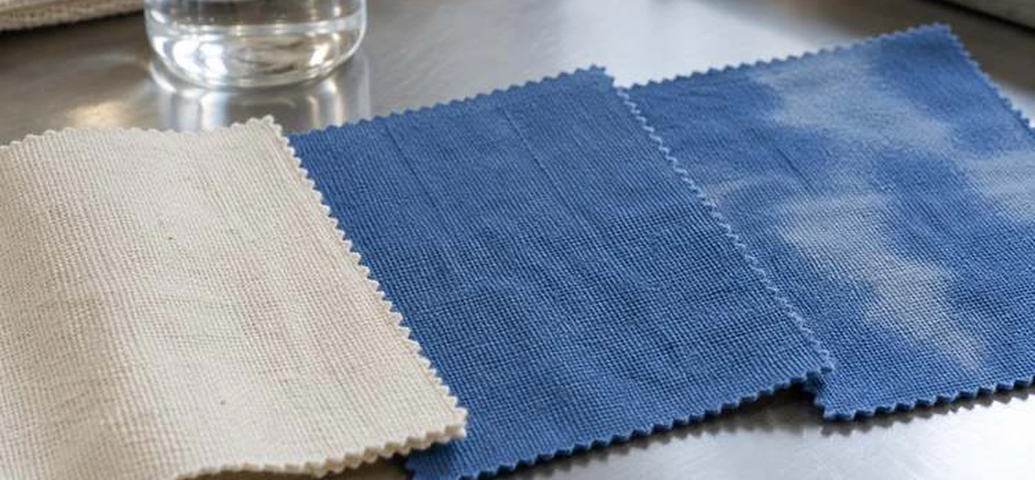 Cotton fabric swatches: undyed and dyed blue samples