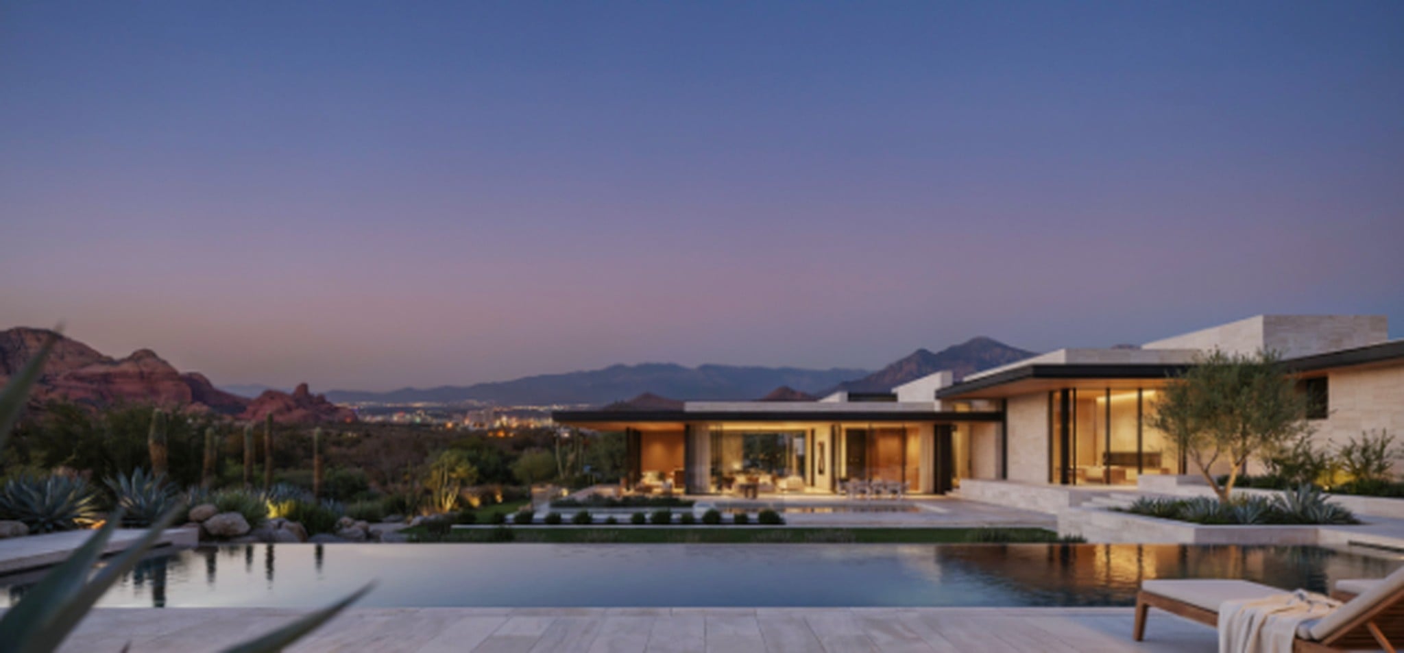 Luxury modern home with pool at dusk in Las Vegas