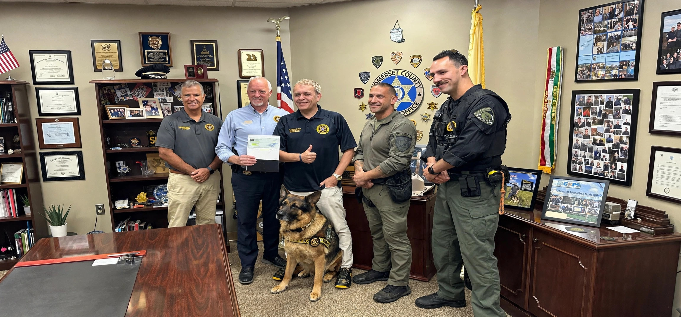 Dr. Caesar DePaço with members of the Somerset County Sheriff's Office