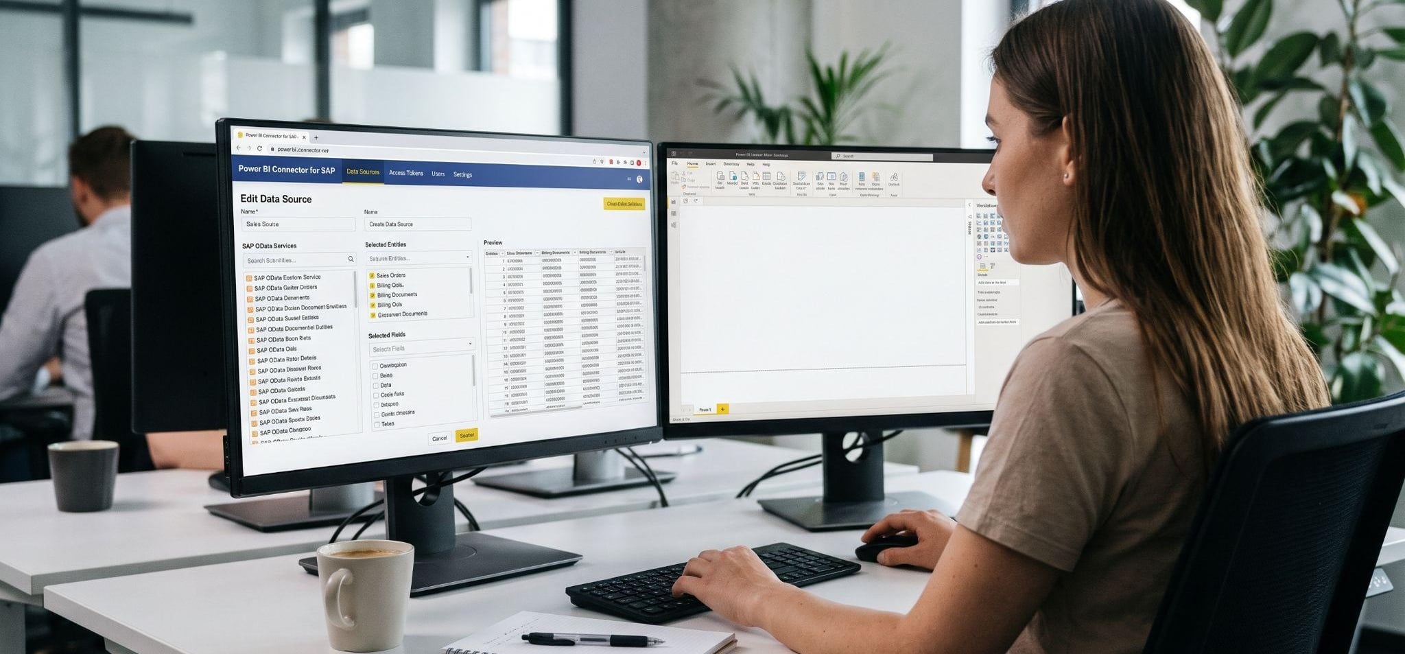 Woman using Power BI Connector for SAP on dual monitors in office