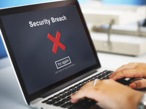 Computer screen displaying a data breach alert, highlighting cyber risks, data security threats, and the role of an 831(b) Plan in business cyber risk management.