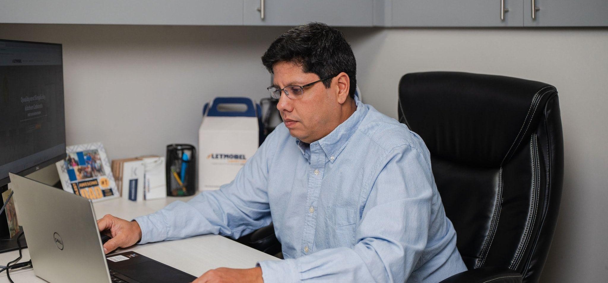 Gerardo Siegert at his desk at Texas Wooden Solutions